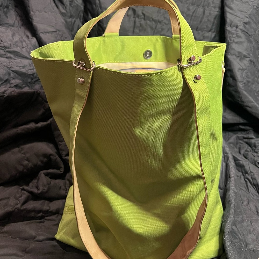 Haerfest Everyday Tote in a lime green color with tan leather straps.
